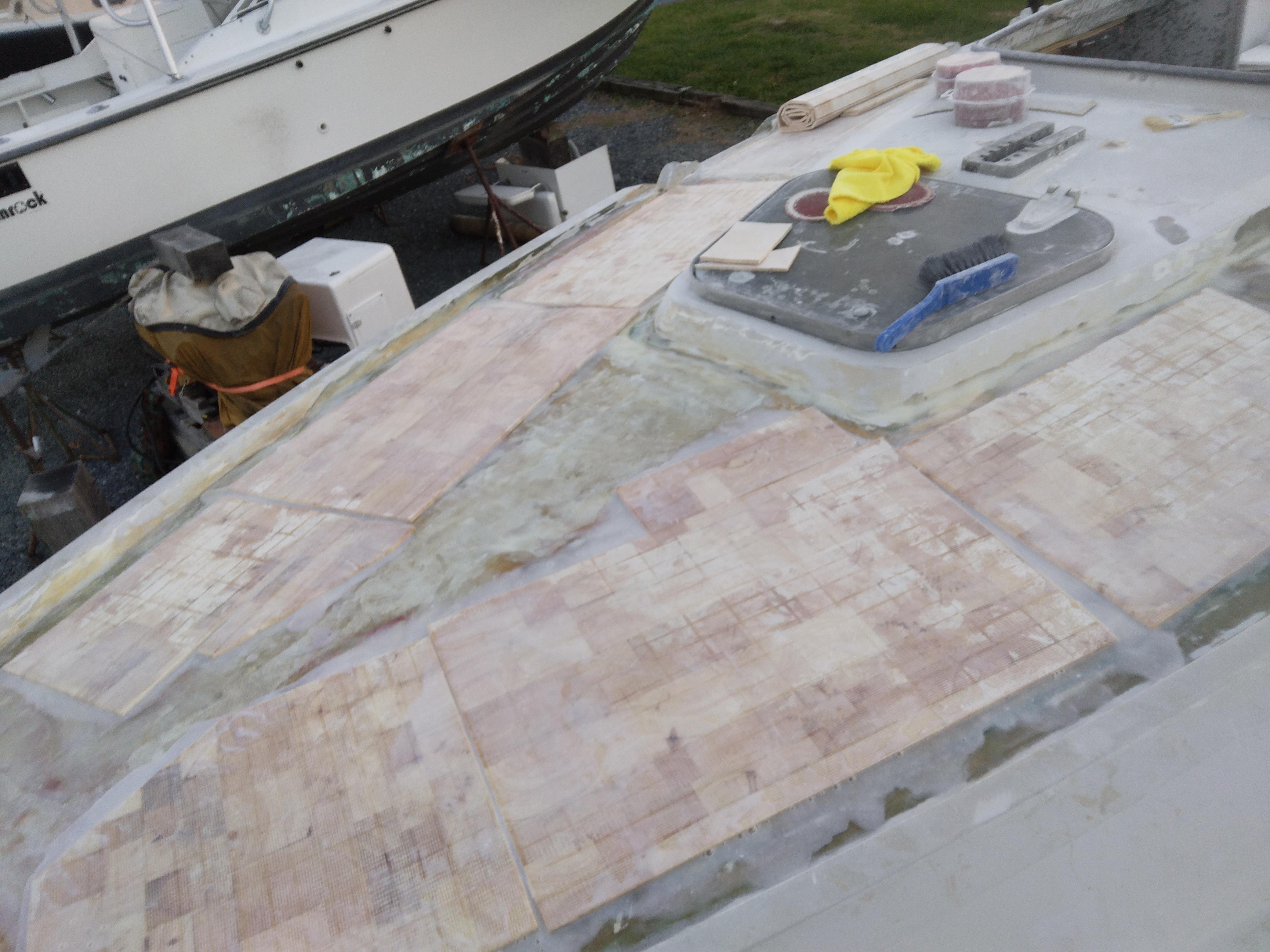 using west systems epoxy products and .25 inch end grain balsa mat, I re-cored the entire deck. As this is my first boat, and I have never attempted anything like this before, it was a large undertaking for me, but the deck is beginning to look better.